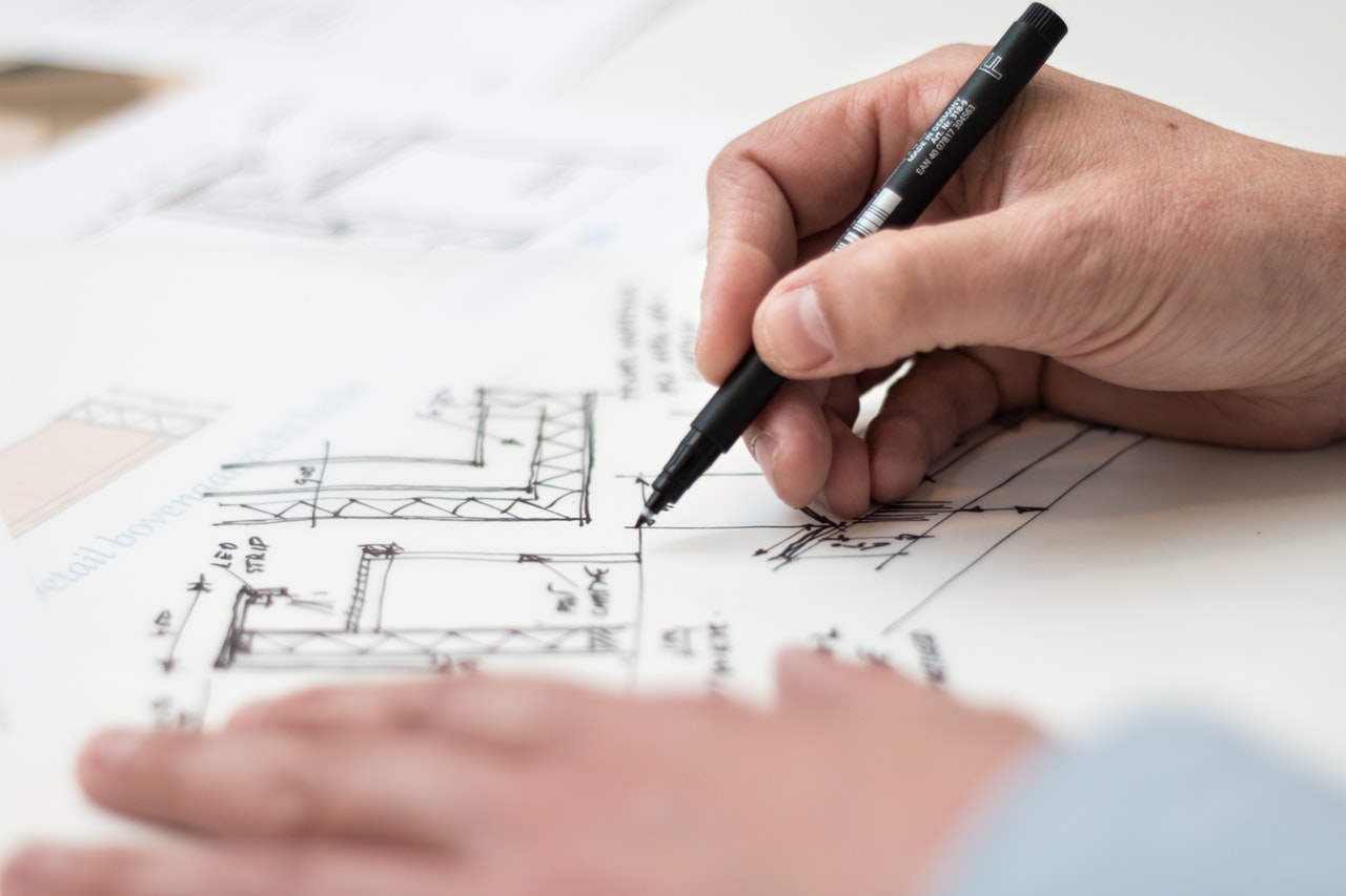 Person drawing floor plan photo